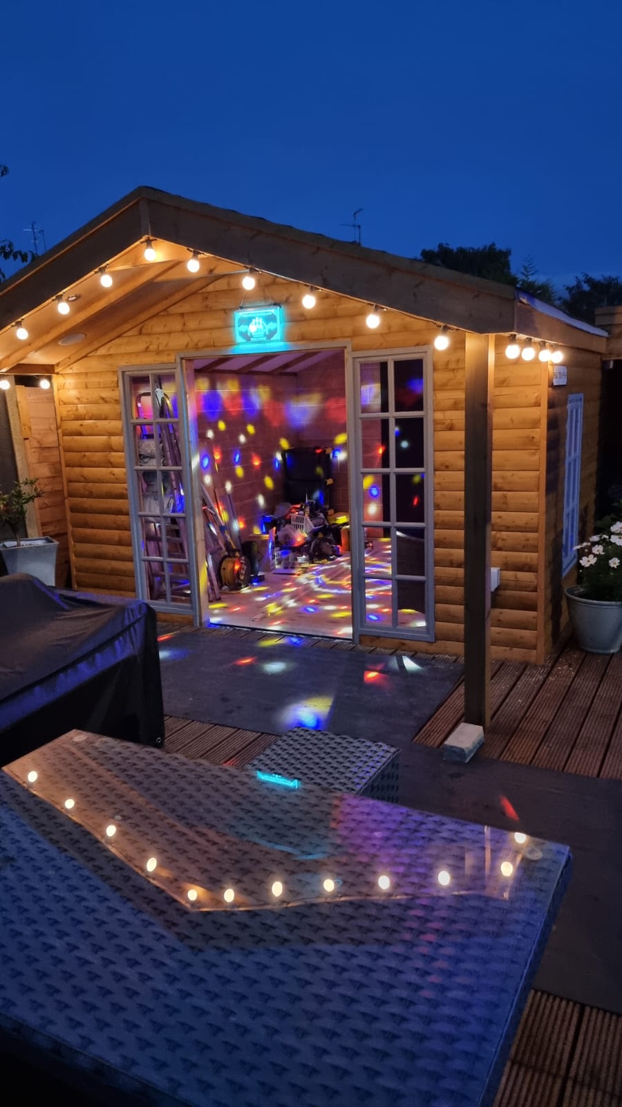 Log lap cladding in garden disco