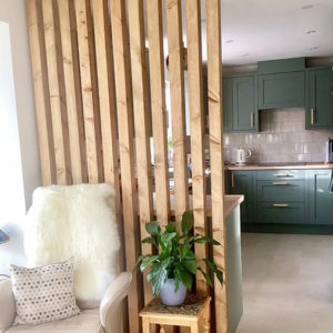 Light oak wooden slat room divider