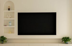Media wall with shelves and TV