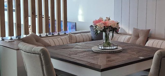 Room divider used to separate a dining table and TV, one of the top room divider ideas.