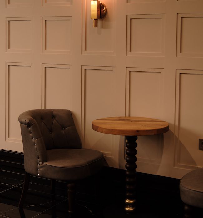Shaker wall panelling with a table and chairs