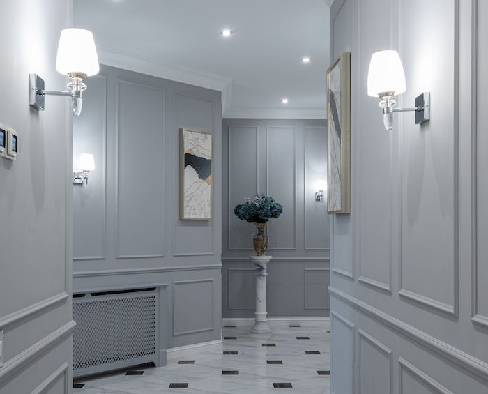 Grey wall panelling in a luxury hallway