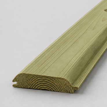 Greenish wooden trim molding piece with a curved profile on a pale surface.