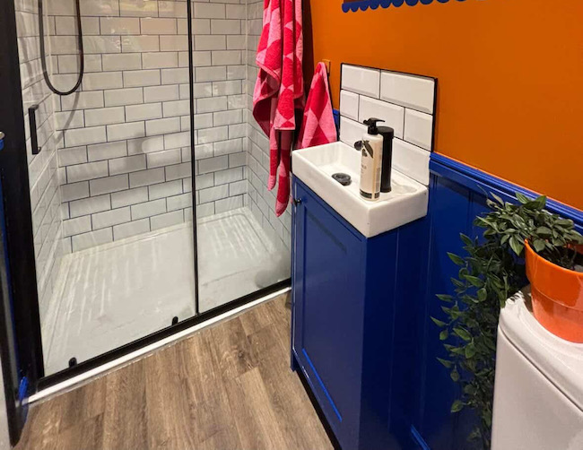 Bathroom decorated with blue wall panelling